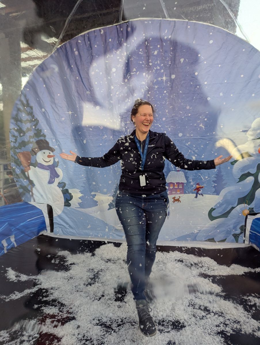 Valerie Lykes smiling in a playful winter scene